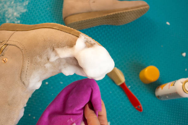 cleaning suede boots - sewing foot imagens e fotografias de stock