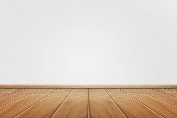 istock Empty interior room with white cement wall texture and brown wooden floor pattern. Concept interior vintage style 1169835966