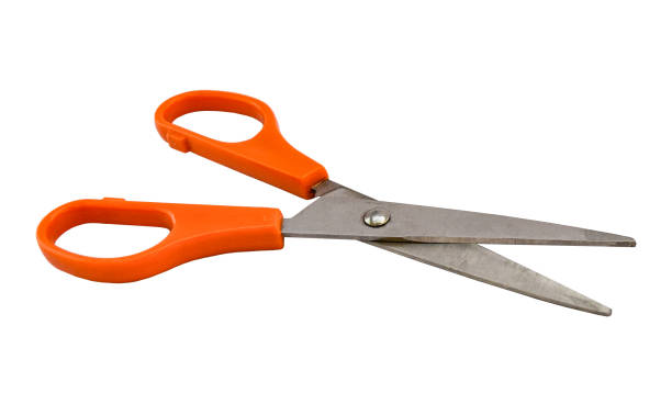 istock Open pair of tailor scissors with orange handle isolated on white background. Object with clipping path. 1169836606