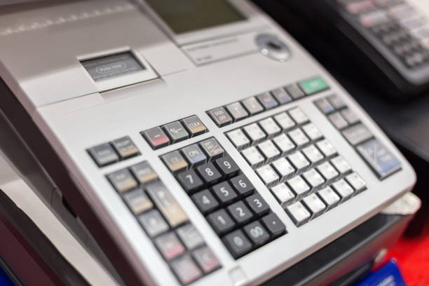 Cash register in a shop: Customer is paying purchase