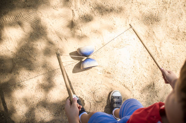 Little boy learning to use diabolo i the park