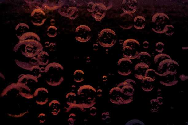 istock Beautiful abstract texture colorful pink and blue soap bubbles on the back and darkness background and wallpaper 1169852148