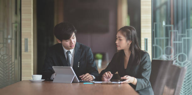 istock Motivated business partner exchanging their ideas 1169852248
