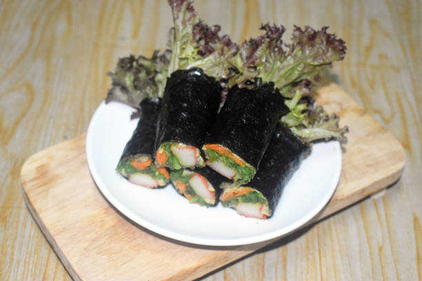 istock mixed vegetables salad roll wrapped with seaweed 1169852861
