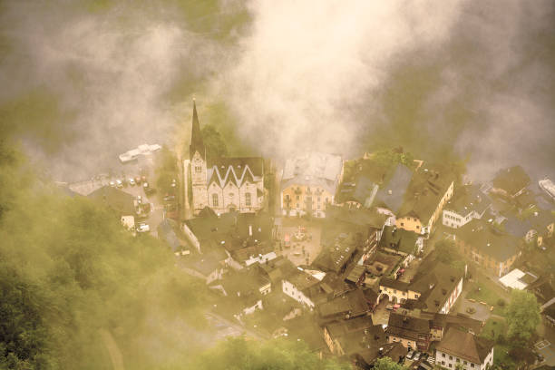 Rain and clouds on the Hallstattersee in Austria. Bird's eye view of the morning mist over the Austrian city of Hallstatt. Vintage style