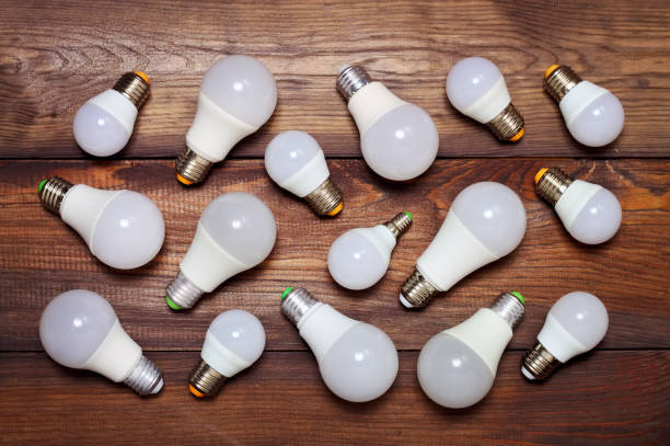 Several led bulbs on a wooden background. stock photo