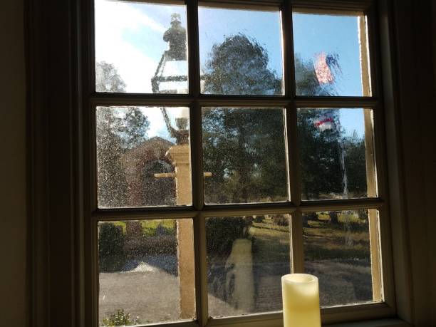 istock candle, thick glass window, and flag outdoor 1169858714