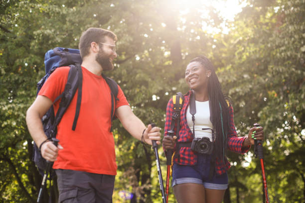 istock Young interracial couple hiking on a mountain 1169867170