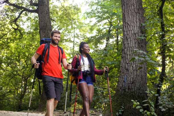 istock Young interracial couple hiking on a mountain 1169867278
