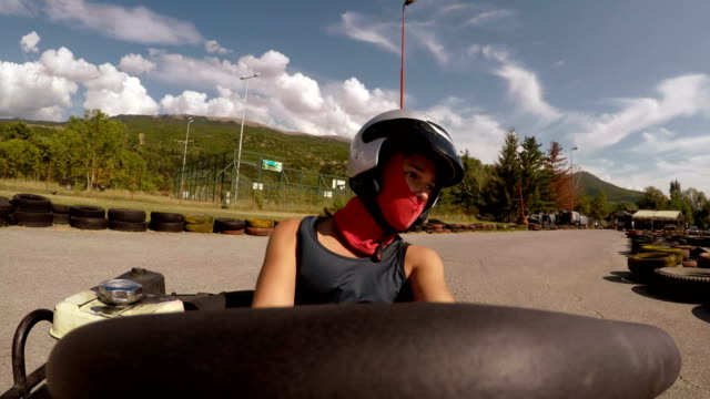 Point of view- young girl drive go-cart