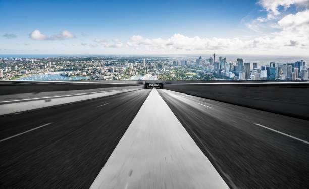 istock Asphalt road towards sydney city 1169870321
