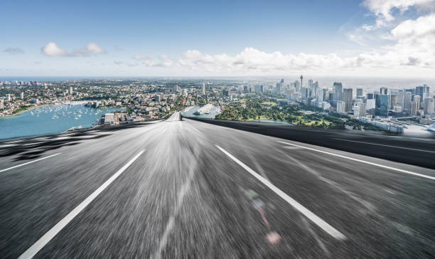 istock Asphalt road towards sydney city 1169870322