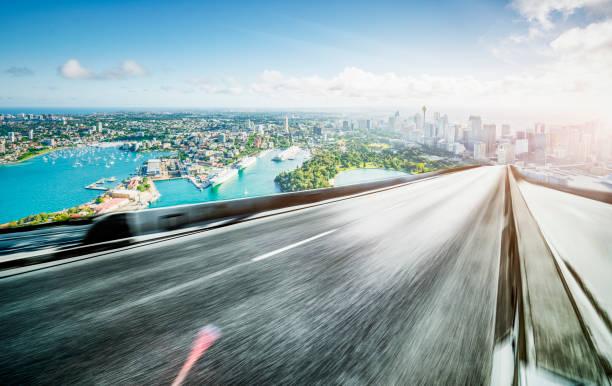 istock Asphalt road towards sydney city 1169870327