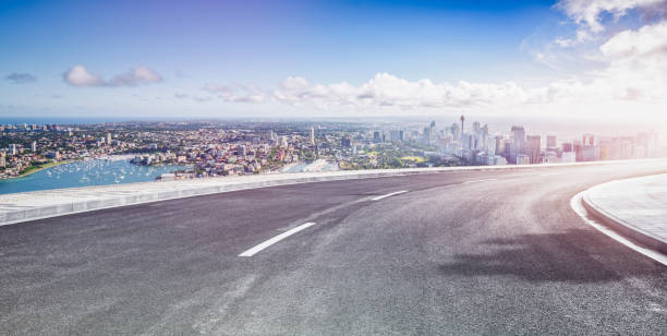 istock Asphalt road towards sydney city 1169870492