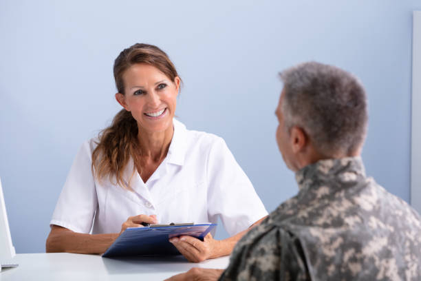 istock Female Doctor Discussing With Army Soldier 1169870537
