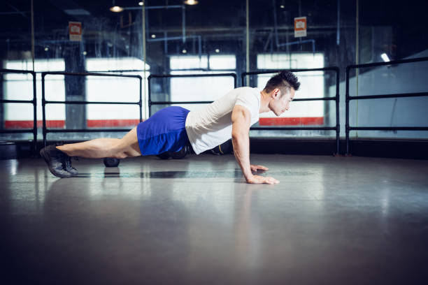 istock Chinese personal trainer in gym. 1169871458