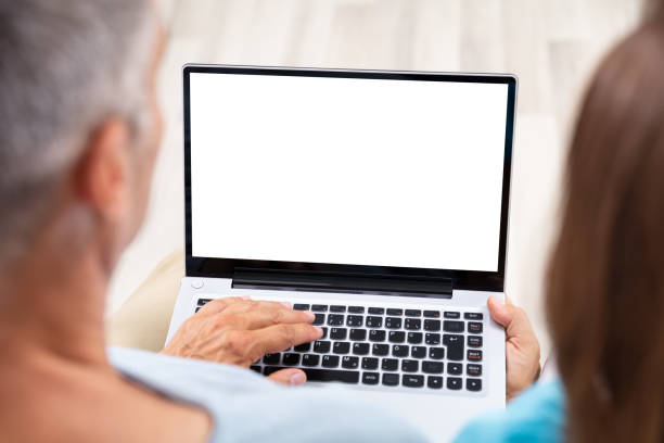 istock Close-up Of A Couple Using Laptop 1169871496