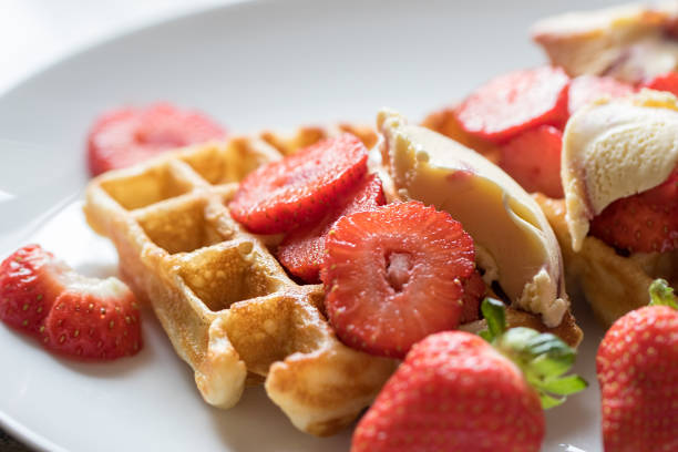 istock Strawberry waffles. Selective focus red fruit breakfast with icecream. 1169871676