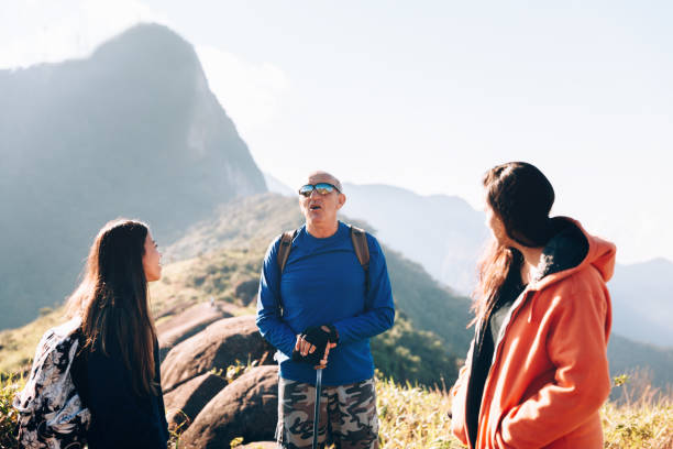 istock Senior man mentoring hiking advices 1169872614