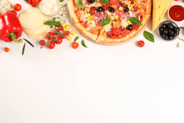 istock Flat lay. Pizza and ingredients: vegetables, cheese on white background, copy space 1169875636