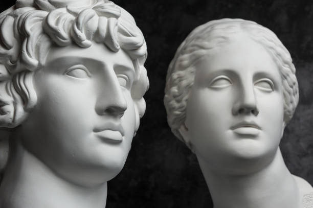 istock Gypsum copy of ancient statue Antinous and Venus head on dark textured background. Plaster sculpture face. 1169876708