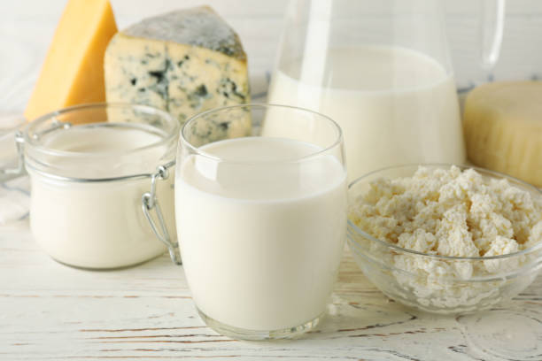 istock Different dairy products on white wooden background, close up 1169876758