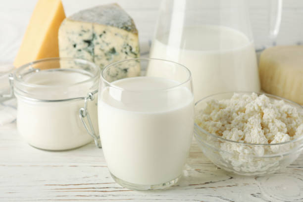 istock Different dairy products on white wooden background, close up 1169880896