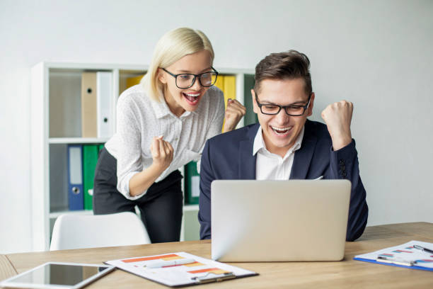 istock Business people celebrate at office 1169881065