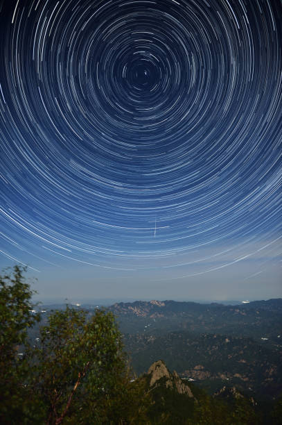 istock Star trails over Wuling Mountain, Hebei Province, China 1169886100