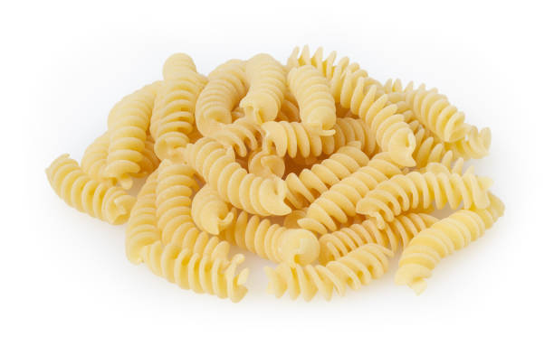 istock Uncooked fusilli pasta isolated on white background with clipping path 1169887011