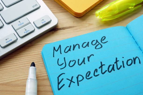 istock Manage your expectations sign on the page. 1169888568