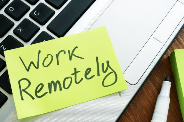 istock Work Remotely memo stick. Laptop for remote job. 1169888589