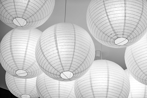 White large spherical paper lampshades glow