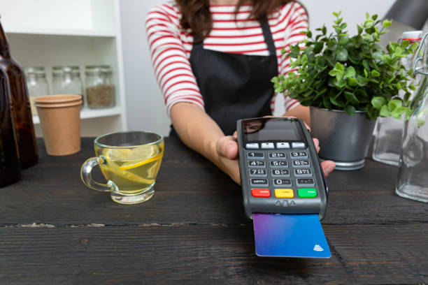 istock Customer making wireless or contactless payment using credit card 1169890428