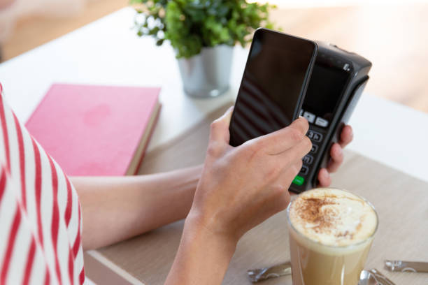 istock Customer making wireless or contactless payment using smartphone, nfc payment 1169890525