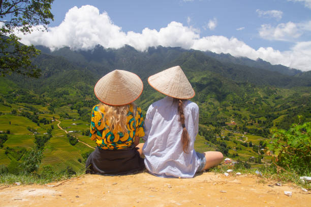 istock Friends in Sapa overlooks rice fields 1169891686