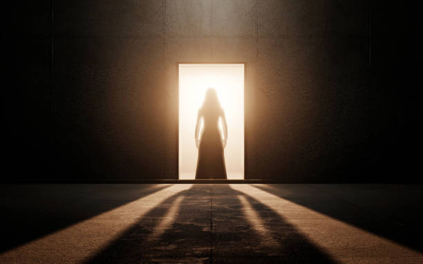 Young Woman Standing On Chair Against Spotlight