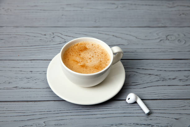 istock wireless headphones and Cup of coffee 1169893399