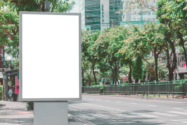 istock led blank billboard white screen side road in city. vertical ad mockup copy space for advertising banner promotion display information in metropolis outdoor street. 1169893681