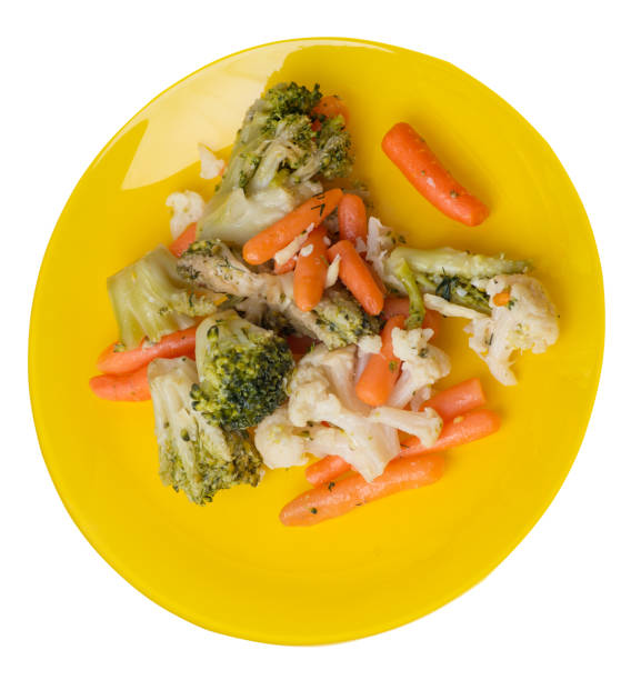 istock provencal vegetables on a plate.grilled vegetables on a plate isolated on white background.broccoli and carrots on a plate top view.healthy  food 1169894500