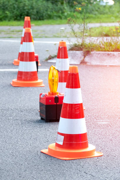 istock Shutting off the road from car accident with traffic cone 1169900315