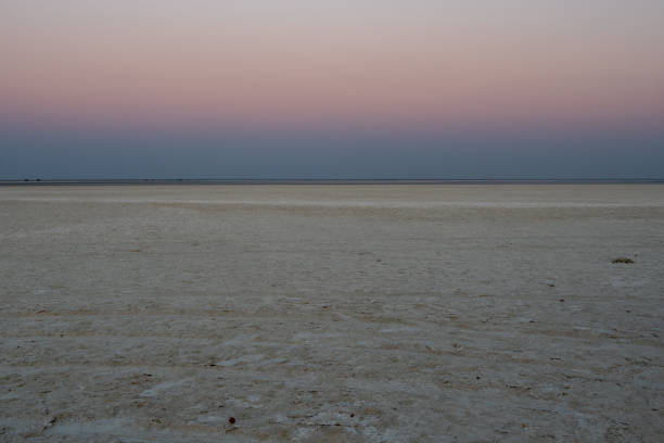 Sunset in Makgadikgadi Salt Pan - Horizon at Romantic Dusk - Empty Flat Plain, Colorful Sky at Twylight
