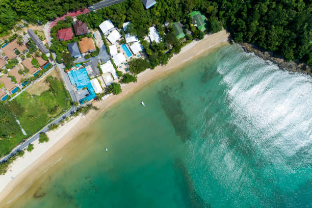 istock Beautiful sea surface with seashore and modern villa image by Drone aerial view Top down 1169901259