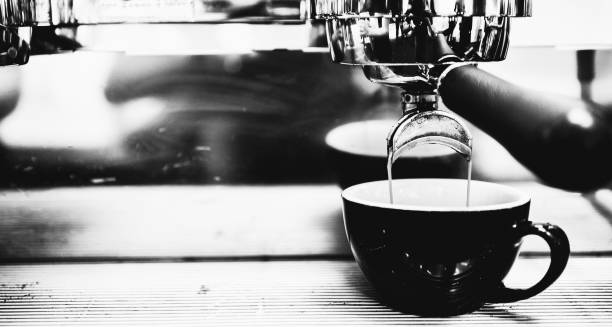 Espresso machine brewing a coffee. Coffee pouring into glasses in coffee shop, espresso pouring from coffee machine