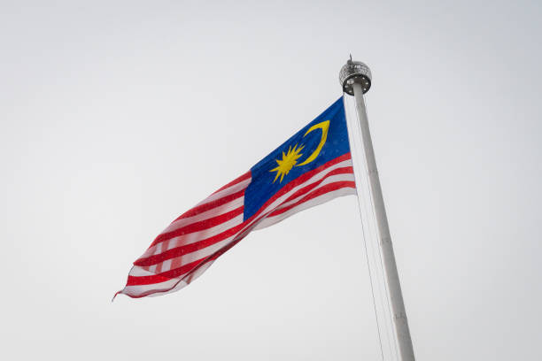 istock Malaysian national flag on huge flag pole during rain 1169909257