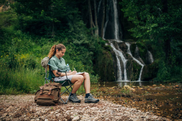 istock Woman biologist taking notes in nature 1169909603
