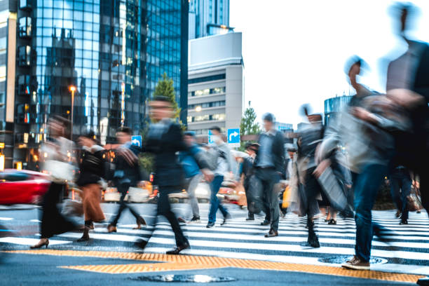 istock Long exposure shot of people commuting to work 1169912372
