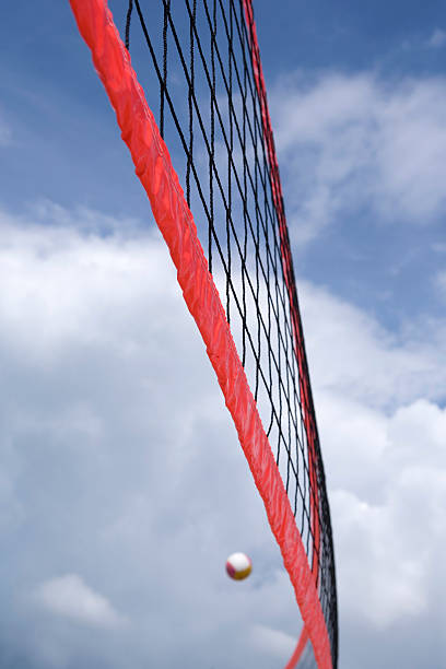 istock ball flying over a beach volleyball net 116991325