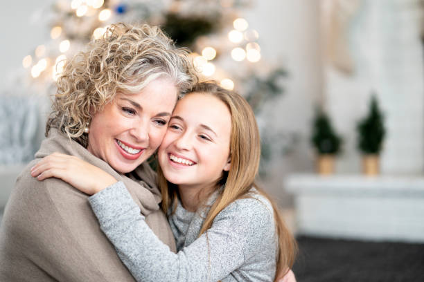 istock Beautiful mother and daughter at Christmas 1169914018