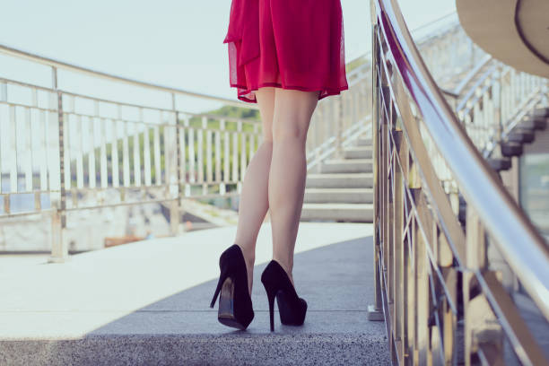 istock Side walk people person ass buttocks take go run posing concept. Rear back behind close up view photo of sexual tempting seductive ideal perfect fit slim legs, cherry color sarafan, railing balcony 1169914907